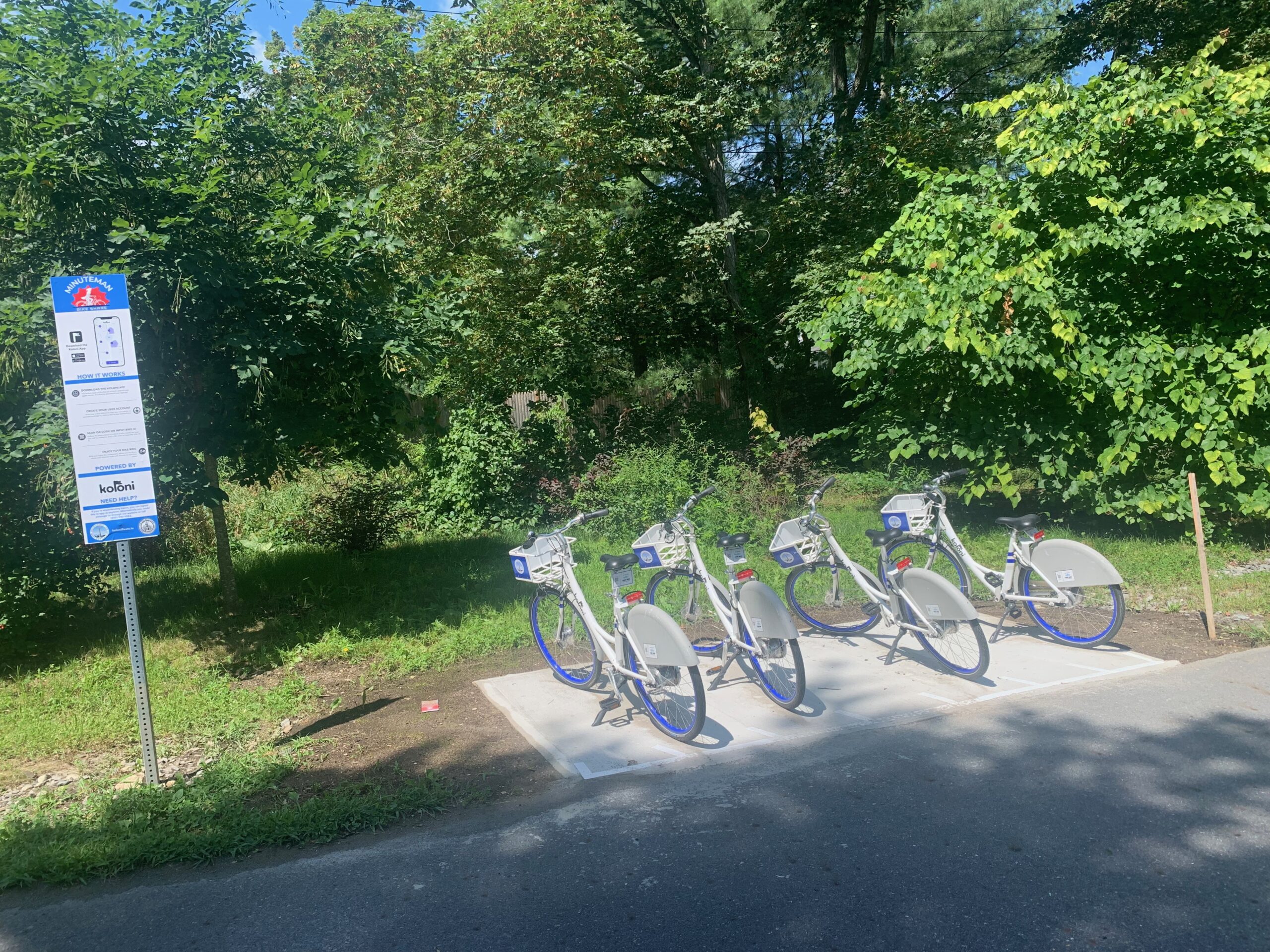 Minuteman Bike Share rental bicycles near Brook Street on the Bruce Freeman Rail Trail in Acton, MA.
